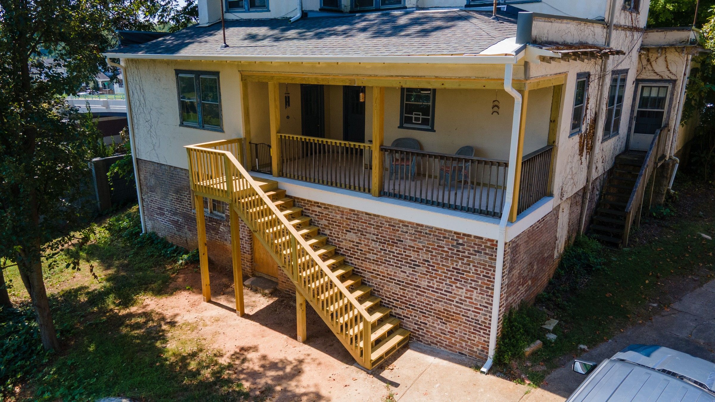 New rear foundation wall, covered porch, and sturdy rear stairs